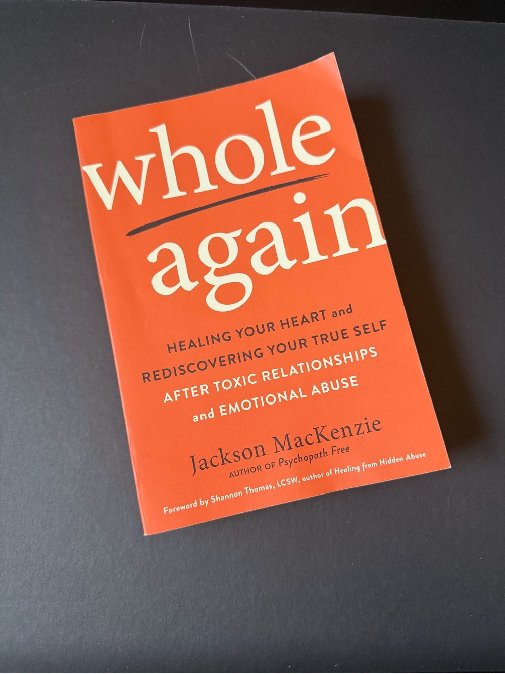 Whole Again by Jackson MacKenzie - Bright Orange Paperback Book